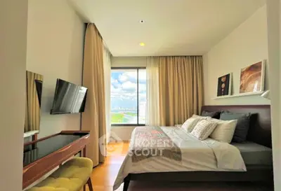 Modern bedroom with city view, stylish decor, and natural light