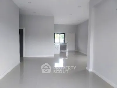 Spacious modern interior with glossy floors and neutral walls, ideal for customization.