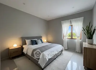 Modern bedroom with elegant decor and natural light