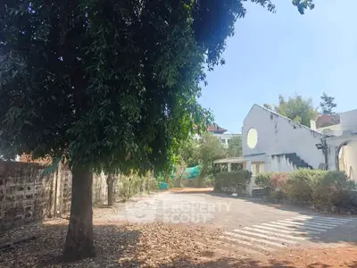 Charming property with spacious outdoor area and lush greenery, perfect for serene living.