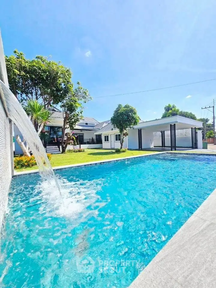 Luxurious property with stunning pool and lush garden, perfect for relaxation and entertainment.