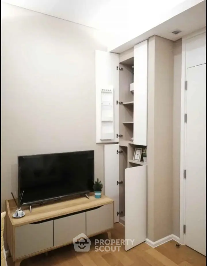 Modern living room with sleek TV stand and hidden storage cabinets