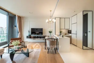 Luxurious open-plan living room with modern kitchen and stunning city view.