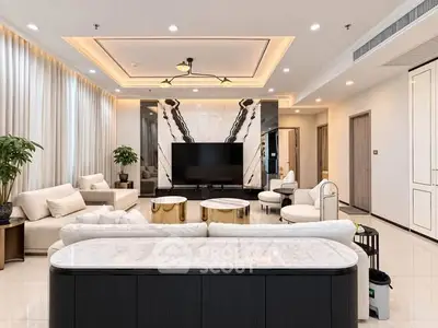 Luxurious modern living room with elegant decor and spacious seating area.