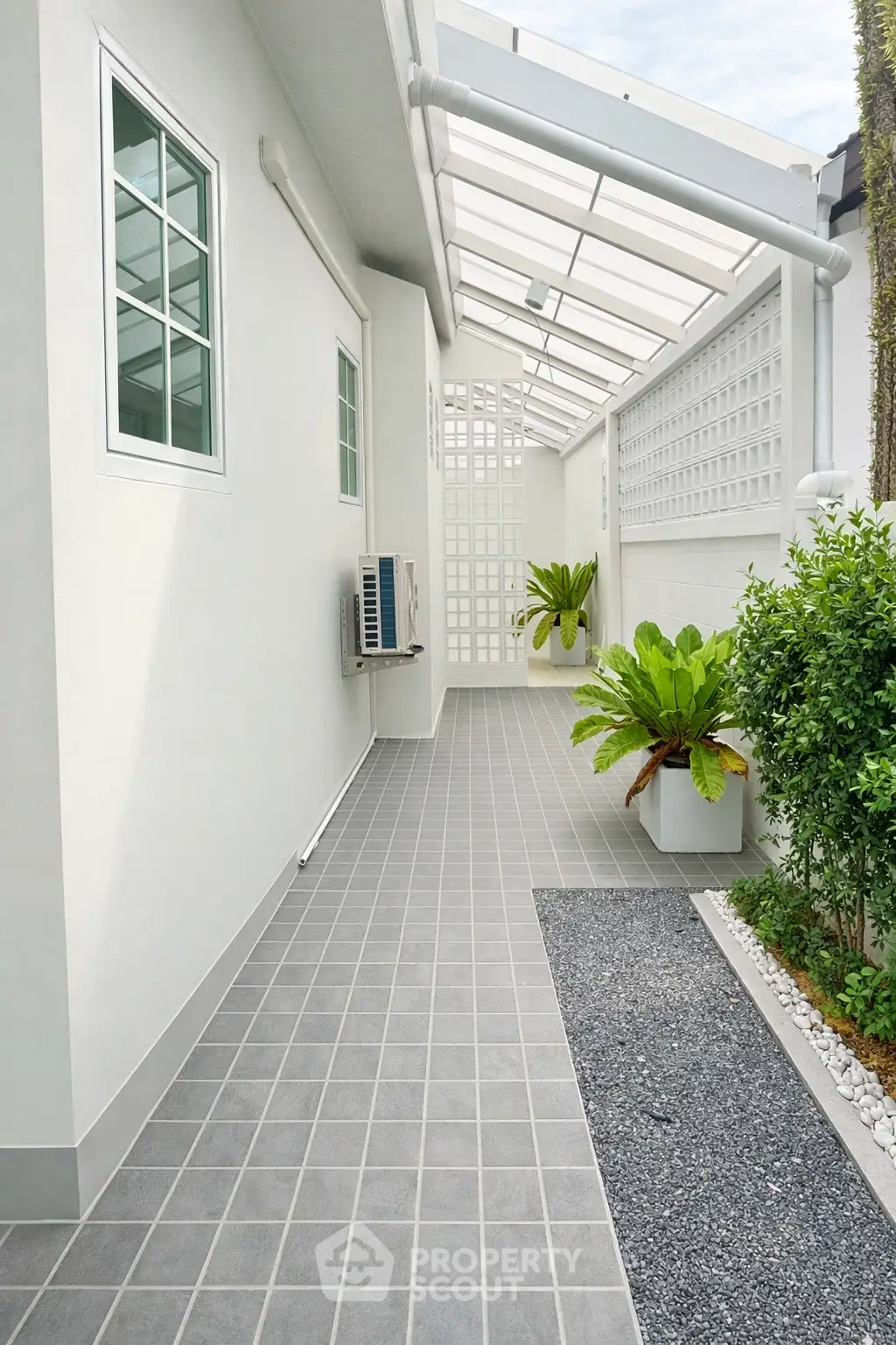 Modern exterior walkway with sleek design and greenery