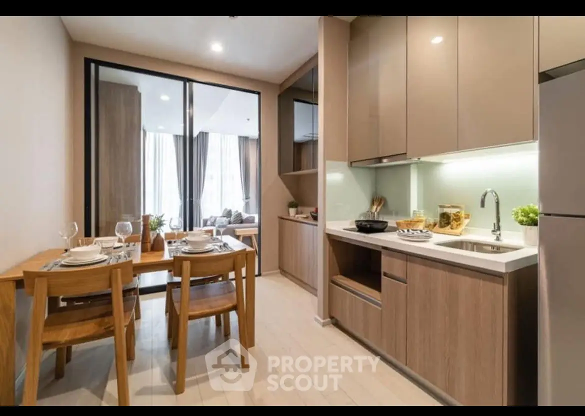 Modern kitchen with open layout and dining area in stylish apartment