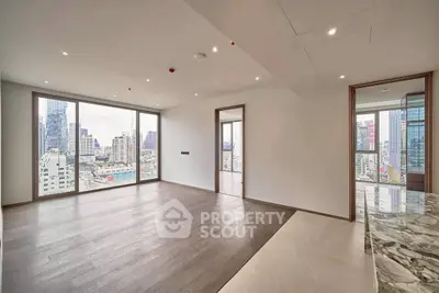 Spacious modern apartment with stunning city views and elegant hardwood floors.