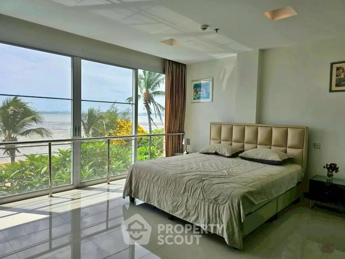 Luxurious beachfront bedroom with stunning ocean views and modern decor