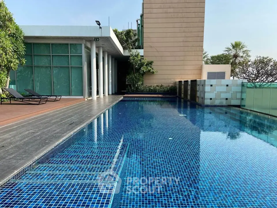 Luxurious rooftop pool with modern design and stunning city views, perfect for relaxation and leisure.