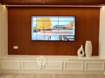 Elegant living room with modern TV setup and stylish decor accents