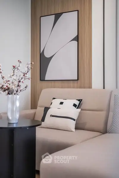 Stylish modern living room with elegant decor and cozy seating arrangement.