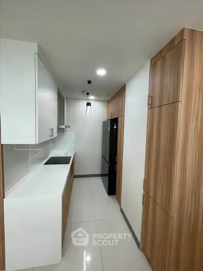 Modern kitchen with sleek cabinetry and spacious layout