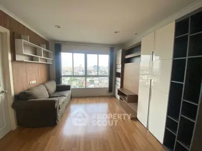 Spacious living room with city view and modern shelving units
