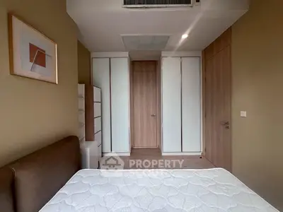 Modern bedroom with minimalist design and ample storage space