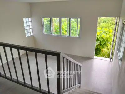 Spacious modern interior with large windows and scenic view