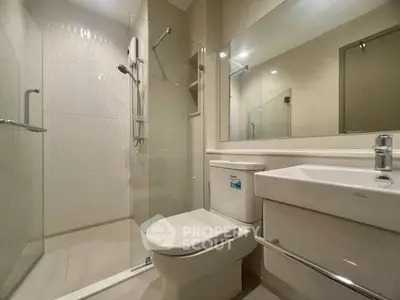 Modern bathroom with glass shower and sleek fixtures