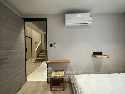 Modern bedroom with air conditioning and minimalist decor