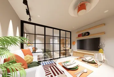 Stylish modern living room with glass partition, vibrant decor, and cozy seating area.