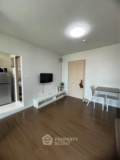 Modern living room with wooden flooring and minimalist decor