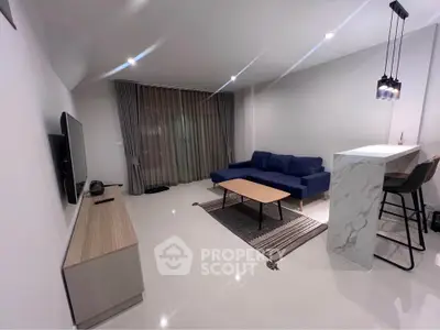 Modern living room with sleek furniture and stylish lighting