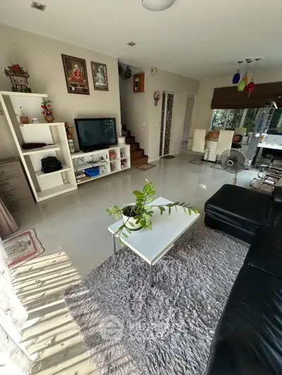 Spacious living room with modern decor and natural light