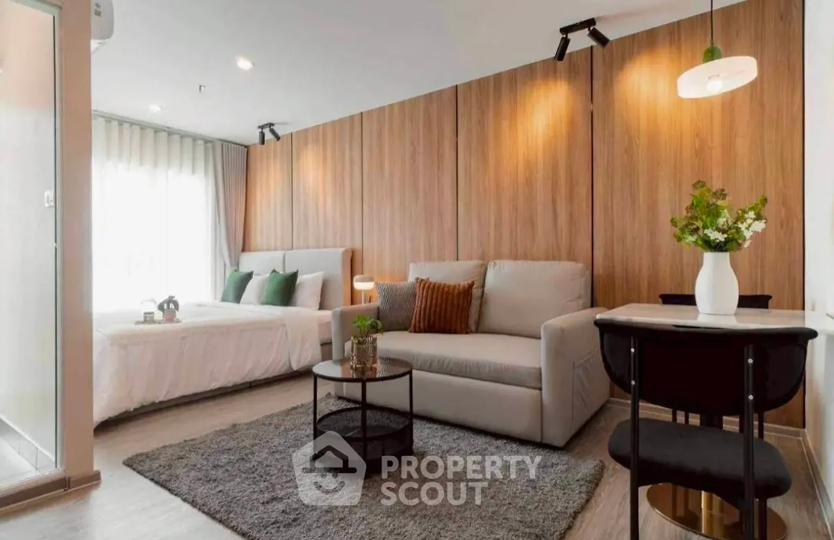 Modern studio apartment with cozy living area and stylish decor