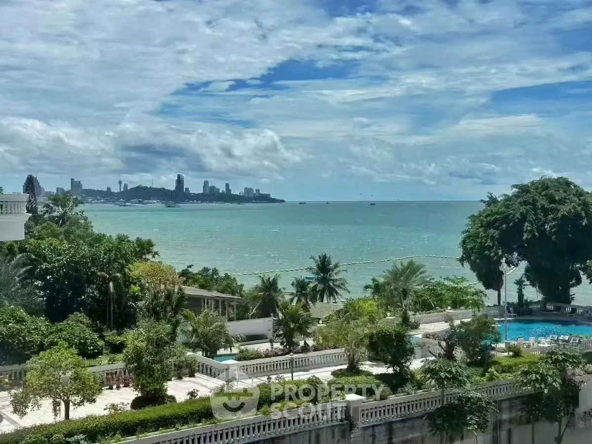 Stunning ocean view from luxury property with lush gardens and pool, perfect for serene living.