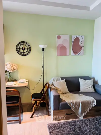 Cozy living room with modern decor and compact dining area