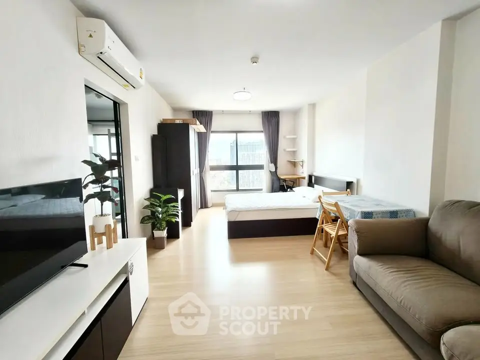 Spacious studio apartment with modern furnishings and natural light