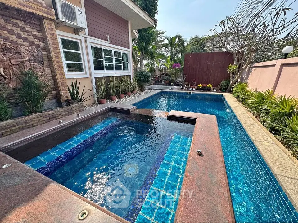 Luxurious private pool with lush garden in serene residential setting