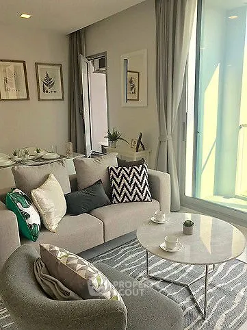 Stylish modern living room with cozy seating and natural light
