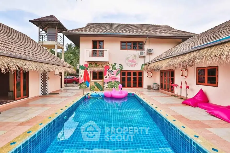 Stunning tropical villa with vibrant pool and playful flamingo decor