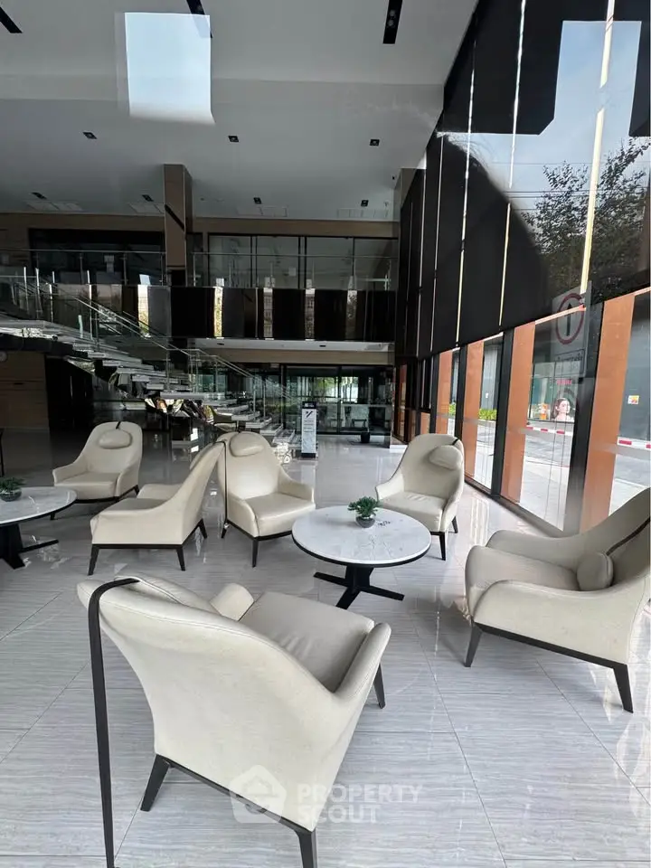 Luxurious modern lobby with elegant seating and floor-to-ceiling windows