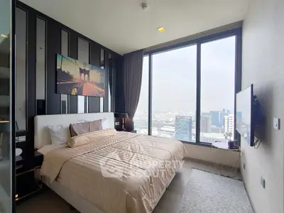 Luxurious bedroom with stunning city view and modern decor