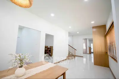 Spacious modern living area with elegant decor and natural light