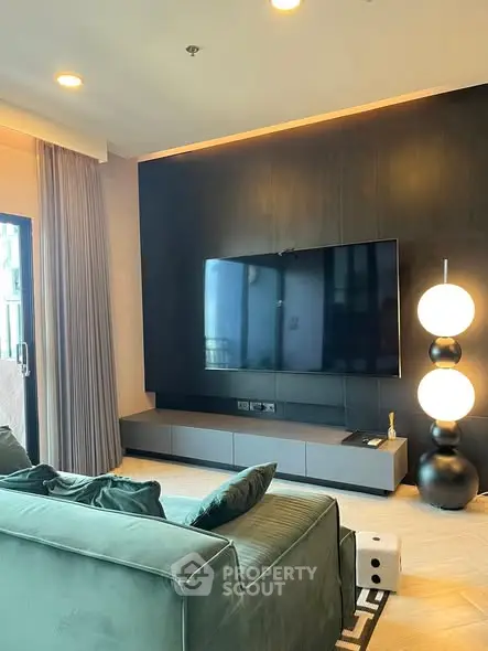 Modern living room with sleek TV setup and stylish lighting
