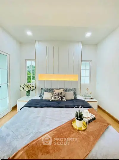 Luxurious bedroom with elegant decor and cozy ambiance, featuring stylish bedding and natural light.