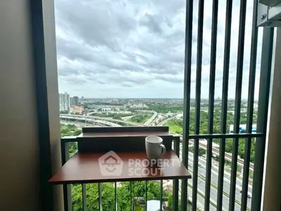 Stunning balcony view with cityscape and lush greenery, perfect for relaxation.