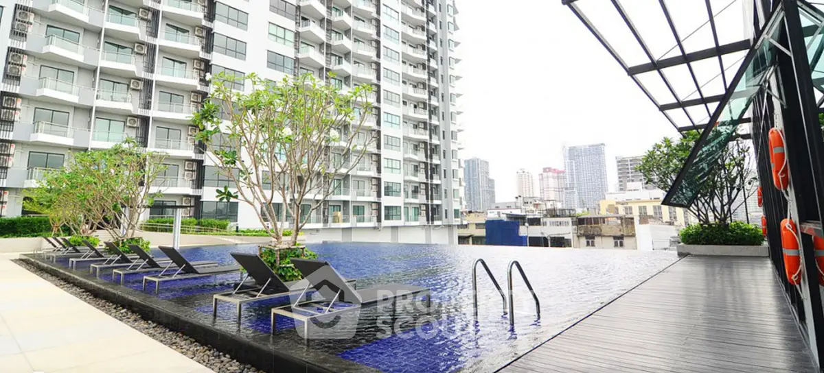 Luxurious rooftop pool with city view in modern high-rise building