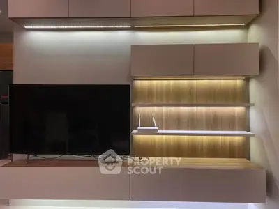 Modern living room with sleek TV unit and ambient lighting