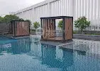 Luxurious poolside cabanas with modern design in a high-end residential complex.