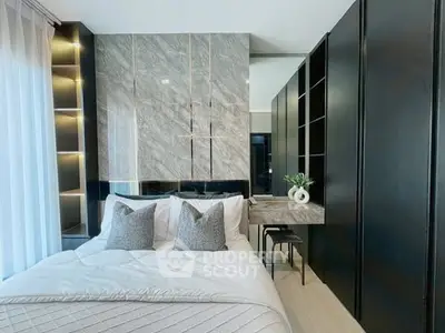 Luxurious modern bedroom with elegant decor and ample natural light
