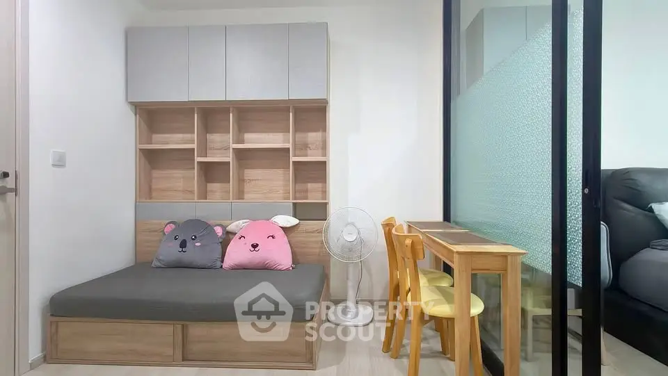 Charming compact living space with cozy seating and modern storage solutions, perfect for urban living.