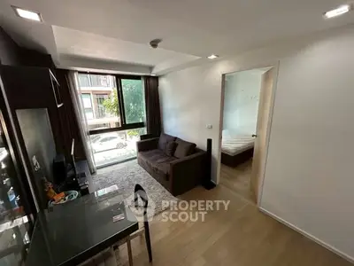 Modern living room with cozy sofa and large window view