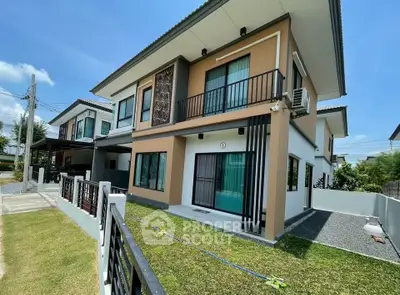 Modern two-story house with balcony and landscaped garden in a suburban neighborhood.