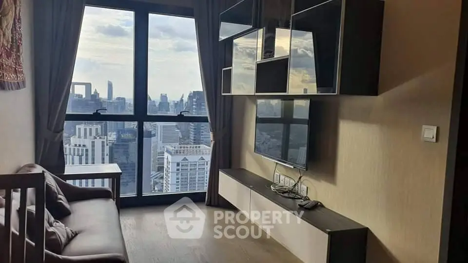 Modern living room with stunning city view and sleek entertainment unit.