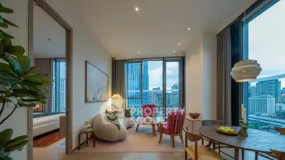 Luxurious modern living room with city skyline view, stylish furniture, and elegant decor.