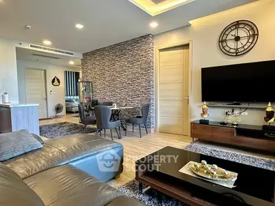 Modern living room with stylish decor and open dining area