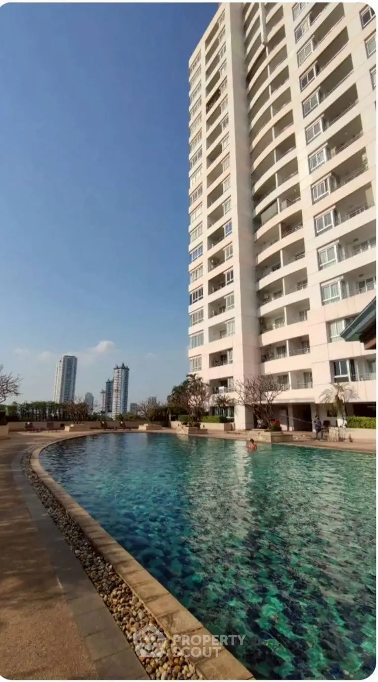 Luxurious high-rise building with stunning pool and city view