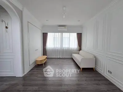 Elegant minimalist living room with white sofa and modern decor